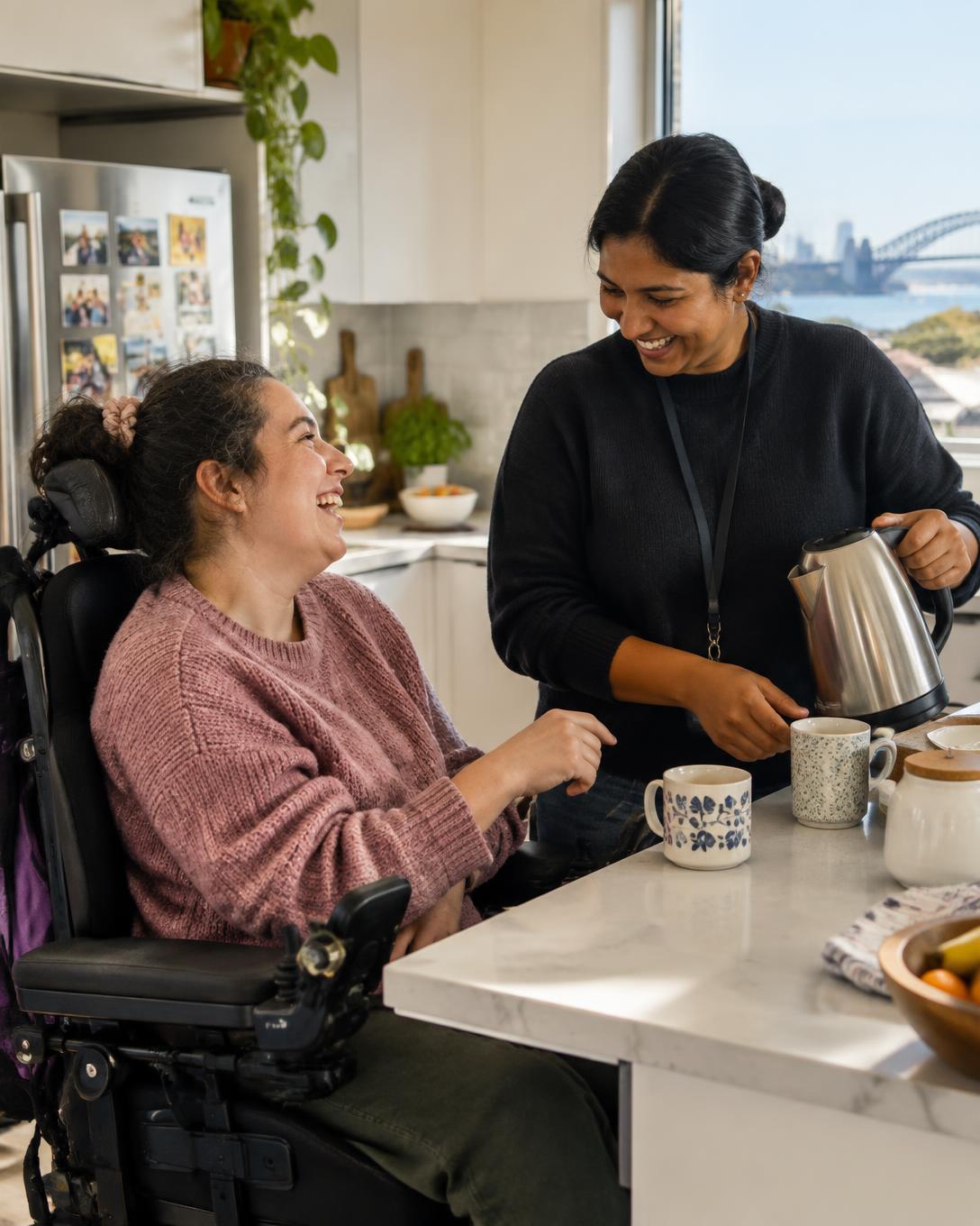 A participant and support worker preparing food together at home